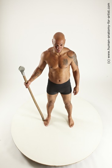 Underwear Fighting with spear Man Black Sitting poses - simple Muscular Bald Sitting poses - ALL Multi angles poses Academic