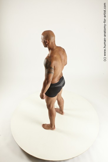 Underwear Fighting with spear Man Black Sitting poses - simple Muscular Bald Sitting poses - ALL Multi angles poses Academic