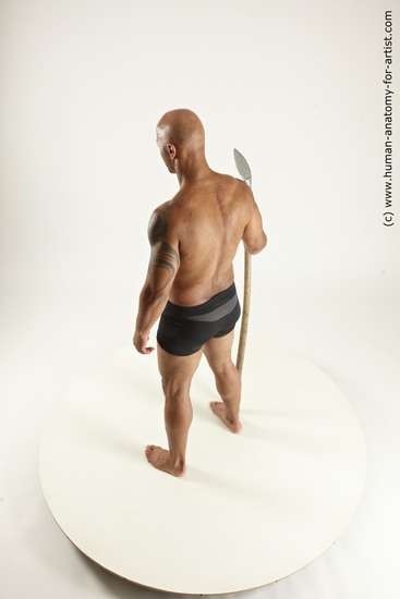 Underwear Fighting with spear Man Black Sitting poses - simple Muscular Bald Sitting poses - ALL Multi angles poses Academic