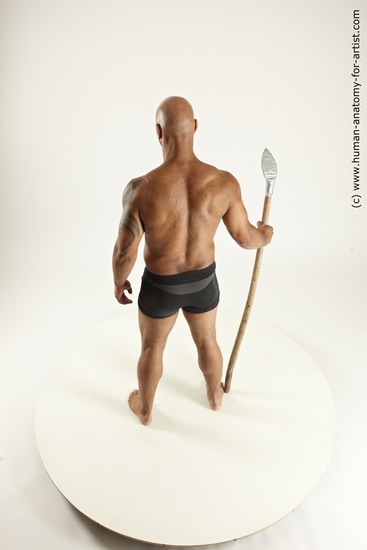 Underwear Fighting with spear Man Black Sitting poses - simple Muscular Bald Sitting poses - ALL Multi angles poses Academic