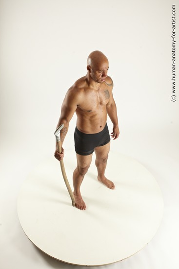 Underwear Fighting with spear Man Black Sitting poses - simple Muscular Bald Sitting poses - ALL Multi angles poses Academic