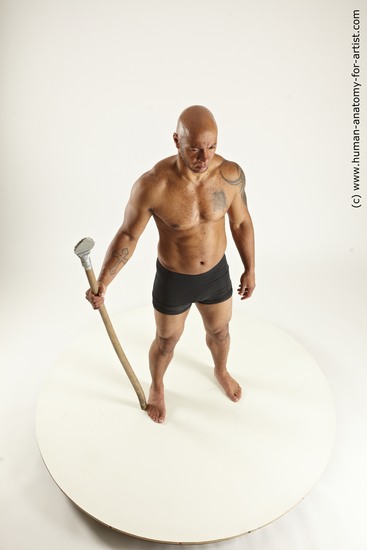 Underwear Fighting with spear Man Black Sitting poses - simple Muscular Bald Sitting poses - ALL Multi angles poses Academic