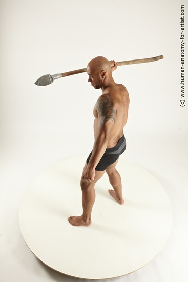 Underwear Fighting with spear Man Black Sitting poses - simple Muscular Bald Sitting poses - ALL Multi angles poses Academic