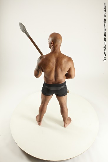 Underwear Fighting with spear Man Black Sitting poses - simple Muscular Bald Sitting poses - ALL Multi angles poses Academic