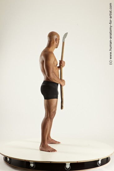 Underwear Fighting with spear Man Black Sitting poses - simple Muscular Bald Sitting poses - ALL Multi angles poses Academic