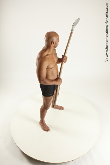 Underwear Fighting with spear Man Black Sitting poses - simple Muscular Bald Sitting poses - ALL Multi angles poses Academic