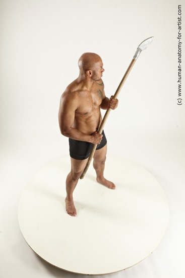 Underwear Fighting with spear Man Black Sitting poses - simple Muscular Bald Sitting poses - ALL Multi angles poses Academic