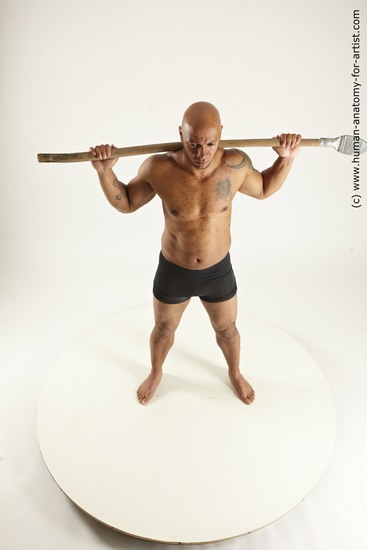 Underwear Fighting with spear Man Black Sitting poses - simple Muscular Bald Sitting poses - ALL Multi angles poses Academic