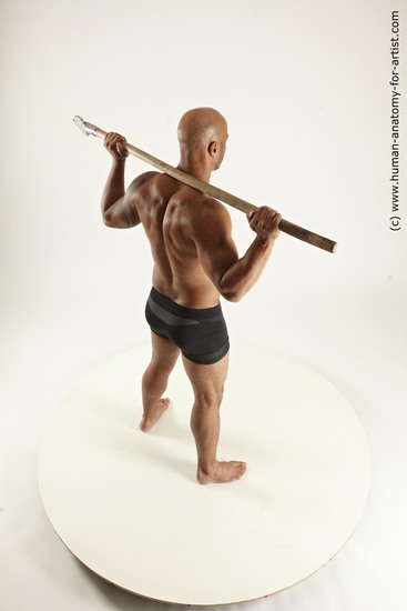 Underwear Fighting with spear Man Black Sitting poses - simple Muscular Bald Sitting poses - ALL Multi angles poses Academic