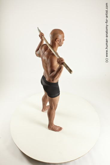 Underwear Fighting with spear Man Black Sitting poses - simple Muscular Bald Sitting poses - ALL Multi angles poses Academic