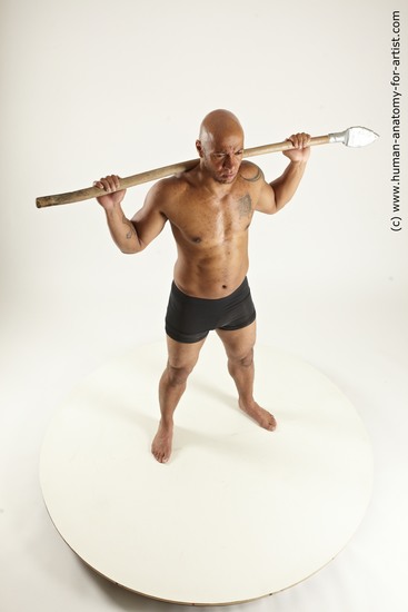 Underwear Fighting with spear Man Black Sitting poses - simple Muscular Bald Sitting poses - ALL Multi angles poses Academic