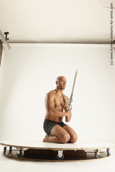 Underwear Fighting with sword Man Black Muscular Bald Multi angles poses Academic