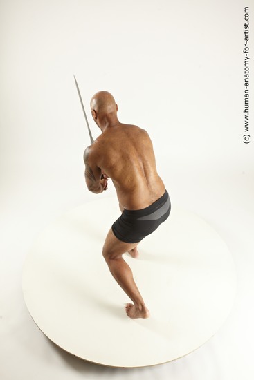 Underwear Fighting with sword Man Black Muscular Bald Multi angles poses Academic