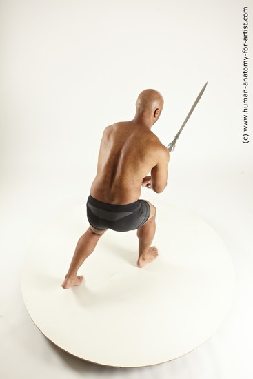 Underwear Fighting with sword Man Black Muscular Bald Multi angles poses Academic