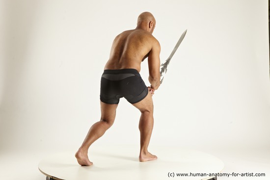 Underwear Fighting with sword Man Black Muscular Bald Multi angles poses Academic