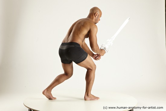 Underwear Fighting with sword Man Black Muscular Bald Multi angles poses Academic