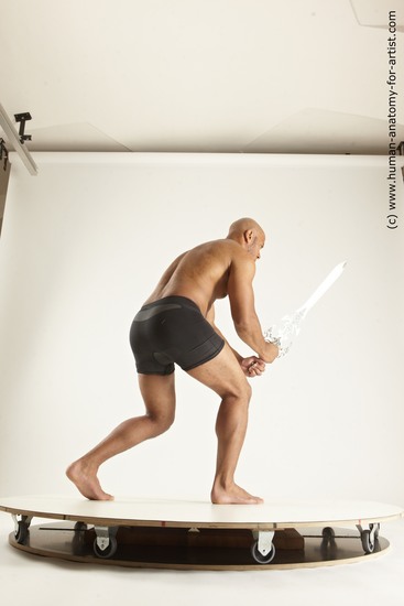 Underwear Fighting with sword Man Black Muscular Bald Multi angles poses Academic