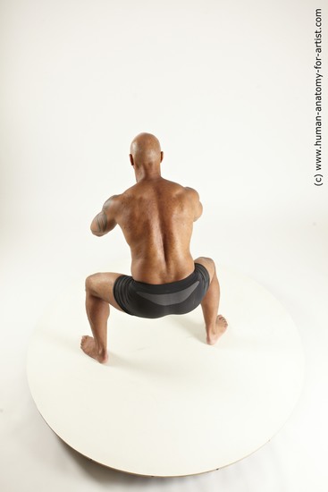 Underwear Fighting with sword Man Black Muscular Bald Multi angles poses Academic