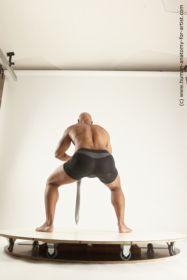 Underwear Fighting with sword Man Black Muscular Bald Multi angles poses Academic