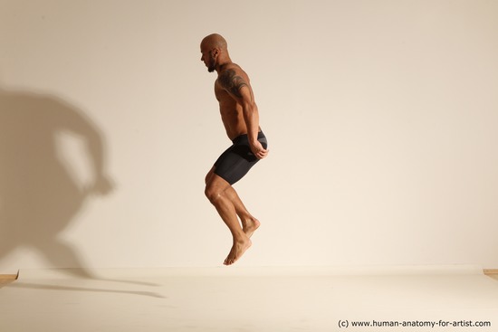 Underwear Man Black Muscular Bald Dynamic poses Academic