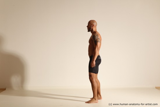 Underwear Man Black Muscular Bald Dynamic poses Academic