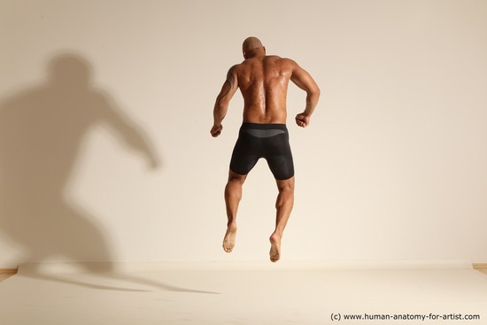 Underwear Man Black Muscular Bald Dynamic poses Academic