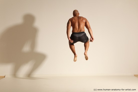 Underwear Man Black Muscular Bald Dynamic poses Academic