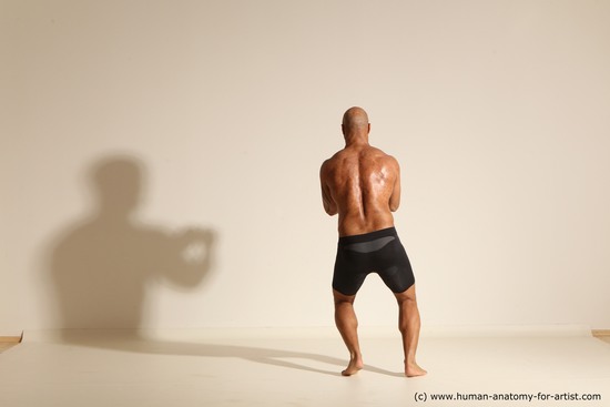 Underwear Man Black Muscular Bald Dynamic poses Academic