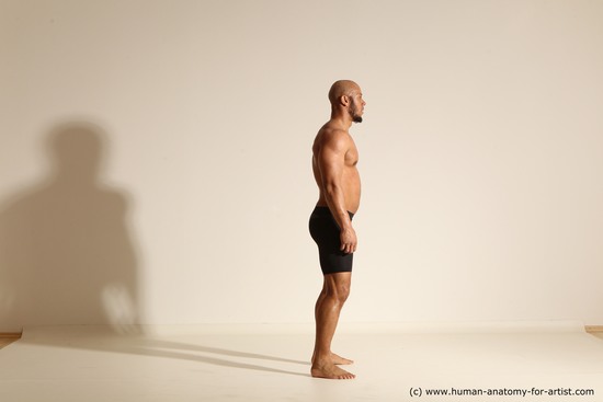 Underwear Man Black Muscular Bald Dynamic poses Academic