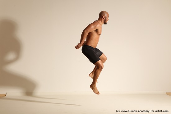 Underwear Man Black Muscular Bald Dynamic poses Academic