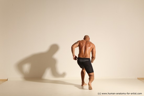 Underwear Man Black Muscular Bald Dynamic poses Academic