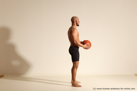 Underwear Man Black Muscular Bald Dynamic poses Academic