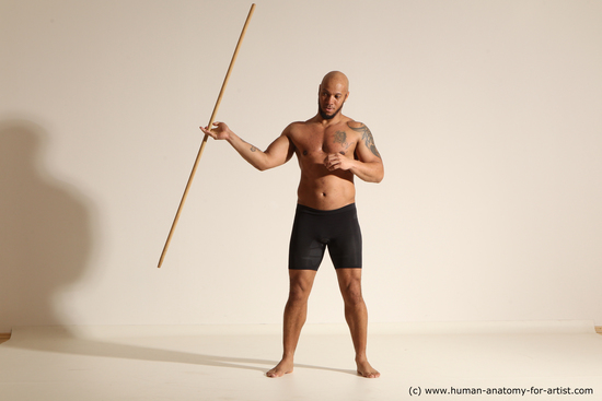 Sportswear Man Black Muscular Bald Dynamic poses Academic