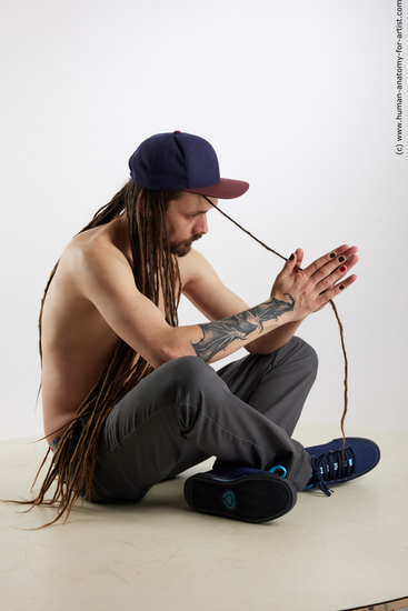 Casual Man White Sitting poses - simple Average Brown Sitting poses - ALL Dreadlocks Standard Photoshoot Academic