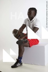 Sportswear Man Black Sitting poses - simple Muscular Black Sitting poses - ALL Dreadlocks Standard Photoshoot Academic