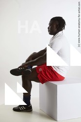 Sportswear Man Black Sitting poses - simple Muscular Black Sitting poses - ALL Dreadlocks Standard Photoshoot Academic