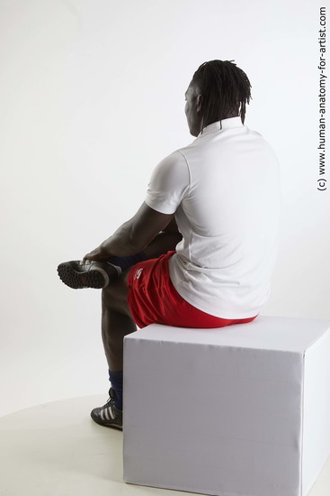 Sportswear Man Black Sitting poses - simple Muscular Black Sitting poses - ALL Dreadlocks Standard Photoshoot Academic