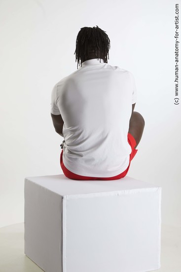 Sportswear Man Black Sitting poses - simple Muscular Black Sitting poses - ALL Dreadlocks Standard Photoshoot Academic