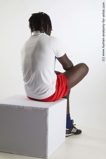 Sportswear Man Black Sitting poses - simple Muscular Black Sitting poses - ALL Dreadlocks Standard Photoshoot Academic