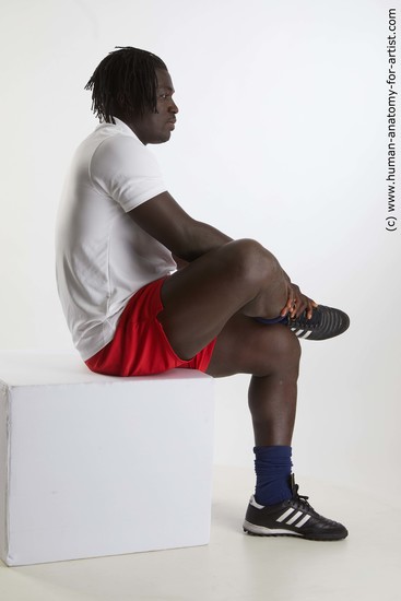 Sportswear Man Black Sitting poses - simple Muscular Black Sitting poses - ALL Dreadlocks Standard Photoshoot Academic