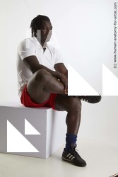 Sportswear Man Black Sitting poses - simple Muscular Black Sitting poses - ALL Dreadlocks Standard Photoshoot Academic