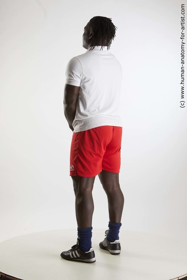 Sportswear Man Black Standing poses - ALL Muscular Black Standing poses - simple Dreadlocks Standard Photoshoot Academic