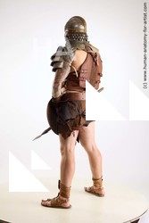 Casual Fighting with sword Man White Sitting poses - simple Muscular Short Brown Sitting poses - ALL Standard Photoshoot Academic Fighting poses - ALL