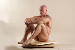 Bodybuilder Sitting