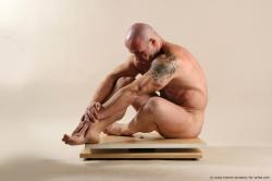 Bodybuilder Sitting