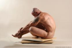 Bodybuilder Sitting