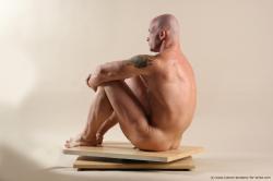 Bodybuilder Sitting