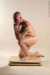 Bodybuilder Kneeling