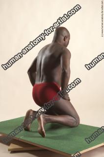 david kneeling 14