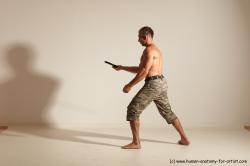 Fighting with sword Man White Moving poses Muscular Short Brown Dynamic poses Academic